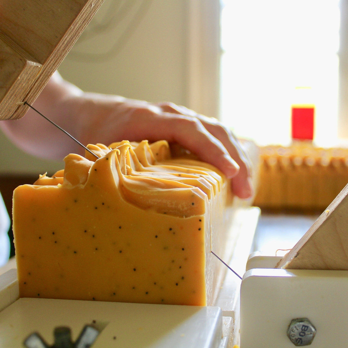Lemon Poppy soap bar in use — natural lemon poppy handmade soap Canada