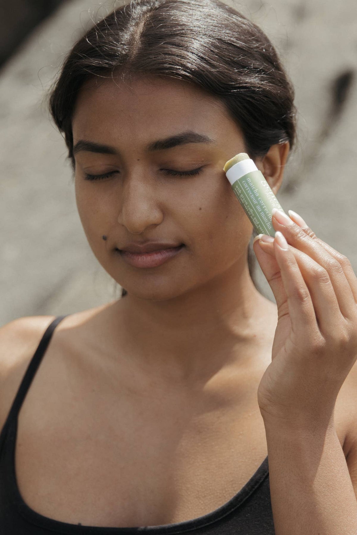 Matcha Corrector Stick in use — natural under eye dark circle stick